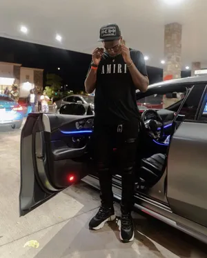 Swavy Lee Holding Glasses Near Mercedes Amg Gt Wallpaper