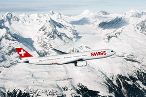 Swiss Airlines Over White Mountains Wallpaper