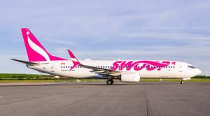 Swoop Aircraft At Runway Wallpaper