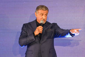 Sylvester Stallone Pointing Microphone Wallpaper