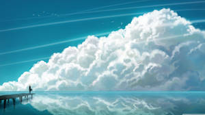 Take In A Breath Of Fresh Air And Marvel At The Beauty Of The Ocean And Clouds Wallpaper