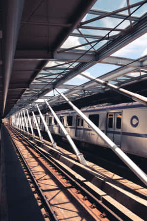 Taking A Train Ride Through The Bustling City Wallpaper