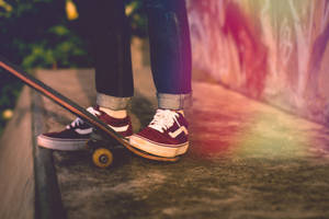 Taking The Skateboarding Style To The Next Level With Red Vans Wallpaper