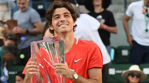 Taylor Fritz Holding Championship Trophy Wallpaper