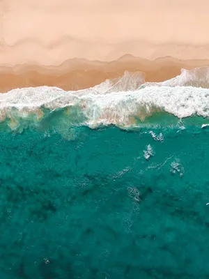 Teal Ocean Waves And Sand Wallpaper