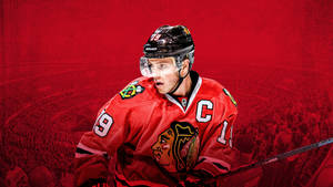 Team Captain No. 19, Jonathan Toews In Action Wallpaper