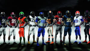 Teams In Vibrant Football Uniforms Wallpaper