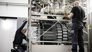 Technician Creating Hydrogen-powered Generators Wallpaper