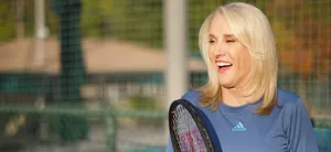 Tennis Legend Tracy Austin Poised With Tennis Racket Wallpaper