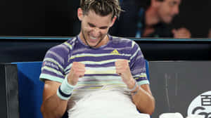 Tennis Player Celebrating Victory Wallpaper