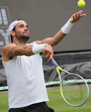 Tennis Player Matteo Berrettini Ball Toss Wallpaper