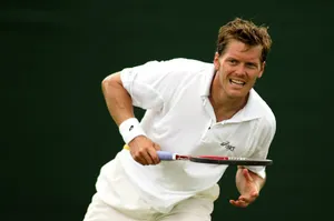 Tennis Player Thomas Enqvist Green Background Wallpaper