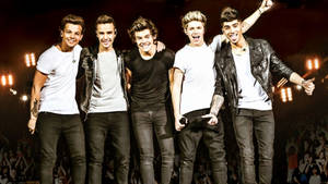 The Band One Direction Surround By Their Loyal Fans Wallpaper