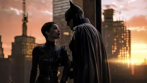 The Batman Pulling Catwoman Close Wallpaper