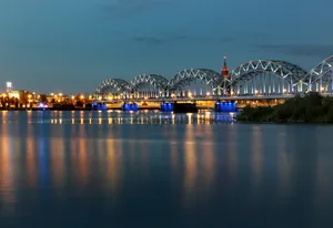 The Beautiful Riga's Railway Bridge At Night Wallpaper