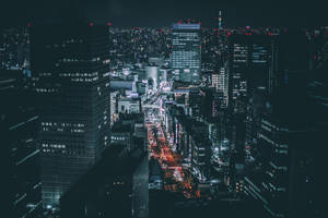 The Bright City Of Tokyo Sparkles At Night Wallpaper