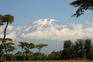 The Cloud-cloaked Peak Of Mount Kilimanjaro Wallpaper