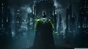 The Dark Knight Looms Over The Skyline Of Batman City. Wallpaper