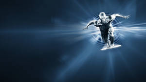 The Fantastic Four With Silver Surfer In Epic Battle Pose Wallpaper