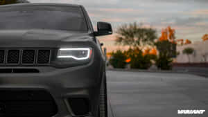 The Front End Of A Black Jeep Grand Cherokee Wallpaper