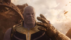 The Mad Titan Thanos Wielding The Infinity Gauntlet Wallpaper