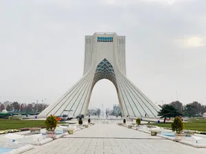 The Majestic Azadi Tower Standing Tall Amidst The Blue Skies Of Tehran. Wallpaper