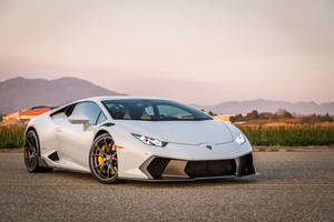 The Majestic White Lamborghini Huracan At Sunset Wallpaper