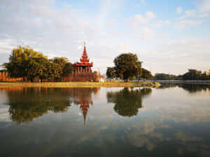 The Moat Centered By Lovely Trees At Mandalay Palace Wallpaper