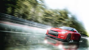 The Powerful Glory – Nissan Skyline Gtr R35 On A Damp Road Wallpaper