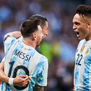 Thiago Almada With Teammate Superstar Messi Wallpaper