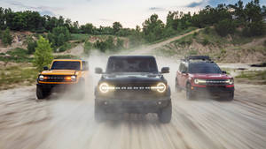 Three Different Colored Ford Bronco Wallpaper