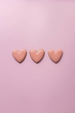 Three Pastel Pink Heart Sugar Cookies Wallpaper
