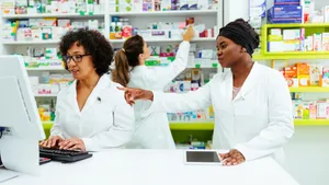 Three Pharmacists Helping Each Other Wallpaper