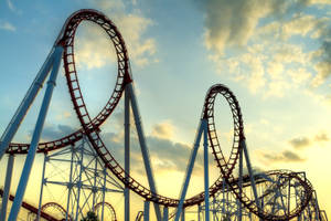 Thrilling Double Looped Roller Coaster Ride Wallpaper