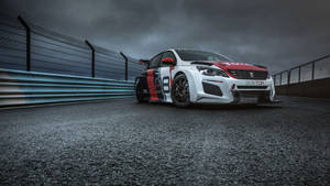 Thrilling Performance Of Peugeot 308 On Racetrack Wallpaper