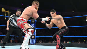Thrilling Wrestling Showdown - Buddy Murphy Vs. Humberto Carrillo In Open Challenge Wallpaper