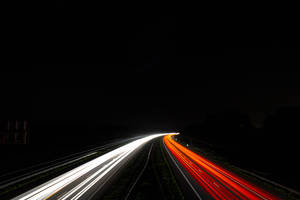 Time-lapse Photography Of Busy Road Wallpaper