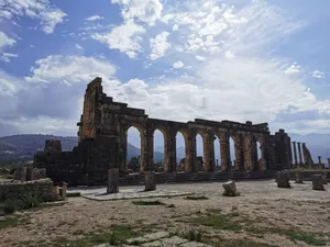 Timeless Remains Of Volubilis Arch Ruins Wallpaper