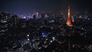 Tokyo Tower Lit Up At Night Wallpaper