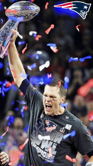 Tom Brady Raising The Championship Trophy Wallpaper