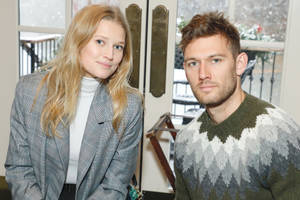 Toni Garrn And Alex Pettyfer Posing Together During An Event Wallpaper