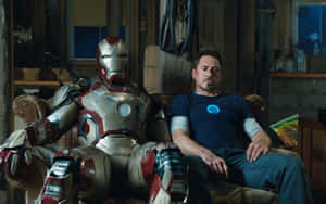 Tony Starkand Iron Man Suit Relaxing Wallpaper