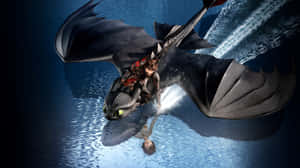 Toothlessand Hiccup Flying Over Water.jpg Wallpaper