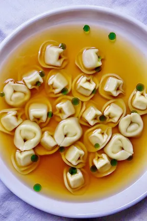 Tortellini In Brodo On A Purple Plate Wallpaper