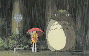 Totoro And Satsuki Walking In The Rain With An Umbrella Wallpaper