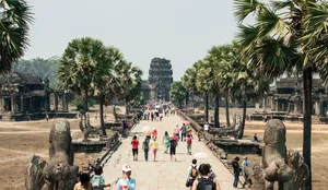 Tourists Walking Towards Angkor Wat Wallpaper