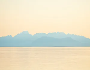 Towering Mountains And Dramatic Ombre Sky Wallpaper