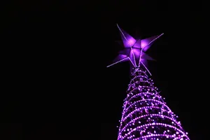 Towering Purple Christmas Tree On A Dark Wallpaper
