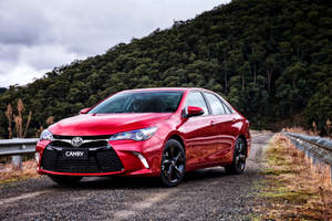 Toyota Camry In Metallic Red Wallpaper