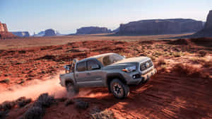 Toyota Trd Driving Fast In The Desert Wallpaper